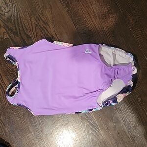 Plum gymnastic leotard. Cupcakes